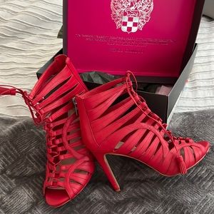 Red Vince Camuto heel. Worn few times. No marks or scuffs.